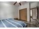 Sunny bedroom featuring wood floors, a ceiling fan, and a double bed next to a closet at 492 Kimmes Ln, Breckenridge, CO 80424