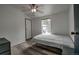 Clean bedroom featuring wood floors, a ceiling fan, and a double bed next to a window at 492 Kimmes Ln, Breckenridge, CO 80424