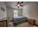 Well-lit bedroom features wood floor, a ceiling fan, and a double bed with two dressers at 492 Kimmes Ln, Breckenridge, CO 80424