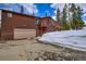 Charming log home with an attached garage, upper deck, and scenic mountain setting at 492 Kimmes Ln, Breckenridge, CO 80424