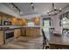 Bright kitchen and dining area with stainless appliances, wood cabinets and floors, and natural light at 492 Kimmes Ln, Breckenridge, CO 80424