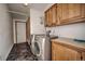 Well-lit laundry room featuring modern washer and dryer with lots of cabinets at 492 Kimmes Ln, Breckenridge, CO 80424