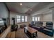 Comfortable living room with a cozy fireplace and large windows offering views of the snowy outdoors at 492 Kimmes Ln, Breckenridge, CO 80424