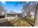 Well-maintained backyard featuring mature trees, a deck, shed, and a partial fence at 6252 W 70Th Pl, Arvada, CO 80003