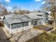 Large backyard features a concrete patio, wood deck, and well-maintained grass at 6252 W 70Th Pl, Arvada, CO 80003