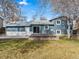 The backyard has mature trees, a deck, and is partially fenced at 6252 W 70Th Pl, Arvada, CO 80003