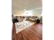 A finished basement with wood floors and a sectional at 6252 W 70Th Pl, Arvada, CO 80003