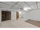 Spacious basement featuring carpeted floors, paneled doors, and staircase access at 6252 W 70Th Pl, Arvada, CO 80003