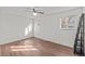 Bedroom with ceiling fan, hardwood floors, and natural light at 6252 W 70Th Pl, Arvada, CO 80003