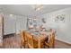 Dining room showcases a chandelier, wood table, and direct access to kitchen and entrance at 6252 W 70Th Pl, Arvada, CO 80003