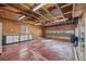 Attached garage featuring built-in cabinetry, work area, and an overhead door with windows at 6252 W 70Th Pl, Arvada, CO 80003