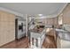 Kitchen includes stainless steel appliances, a kitchen island, and light wood cabinets at 6252 W 70Th Pl, Arvada, CO 80003