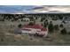 Aerial view of a beautiful home with red roof and large backyard, set in a peaceful neighborhood at 19185 Breton Pl, Monument, CO 80132