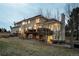 Back exterior of a two-story home with deck, patio and walkout basement at 19185 Breton Pl, Monument, CO 80132