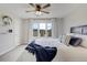 Inviting bedroom with a ceiling fan, large windows, and comfortable bedding at 19185 Breton Pl, Monument, CO 80132