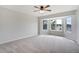 Spacious bedroom with ceiling fan and multiple windows providing lots of natural light and beautiful outdoor views at 19185 Breton Pl, Monument, CO 80132