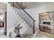 Elegant entryway with curved staircase, modern black iron railing, and stylish decor at 19185 Breton Pl, Monument, CO 80132