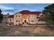 Stunning two-story home boasts a red tile roof, grand entrance, and beautifully landscaped front yard at 19185 Breton Pl, Monument, CO 80132