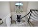 Grand foyer with soaring ceilings, modern chandelier, and staircase at 19185 Breton Pl, Monument, CO 80132