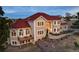 Beautiful home with a red roof, manicured lawn, and charming entry at 19185 Breton Pl, Monument, CO 80132