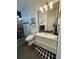 Modern bathroom with a sleek vanity, glass-enclosed shower, and stylish finishes at 653 Glenarbor Cir, Longmont, CO 80504