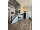 Open foyer featuring high ceilings, staircase, and stylish decor at 653 Glenarbor Cir, Longmont, CO 80504