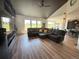 Inviting living room with large sectional sofa and entertainment center at 653 Glenarbor Cir, Longmont, CO 80504