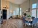 Bright living room with high ceilings, lots of windows, dining area and stylish chandelier at 653 Glenarbor Cir, Longmont, CO 80504