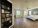 Bright, spacious bedroom featuring large windows with scenic views and a cozy reading nook at 653 Glenarbor Cir, Longmont, CO 80504