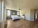 Oversized main bedroom with abundant natural light and space for a sitting area at 653 Glenarbor Cir, Longmont, CO 80504