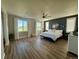 Spacious bedroom with large windows, ample natural light, and modern decor elements at 653 Glenarbor Cir, Longmont, CO 80504