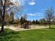 A playground with slides and swings provides a fun and active space for children in a safe and well-maintained environment at 653 Glenarbor Cir, Longmont, CO 80504