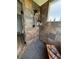 Close up view of updated tile shower and bench with unique stone flooring at 653 Glenarbor Cir, Longmont, CO 80504