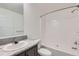A cozy bathroom with a shower-tub combination and granite-look countertops at 6261 Red Cedar St, Frederick, CO 80530