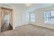 Spacious bedroom with neutral carpet and a window, offering a comfortable retreat at 6261 Red Cedar St, Frederick, CO 80530