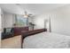 Relaxing bedroom with a large window, dresser, and comfortable seating area at 4733 S Vivian Ct, Morrison, CO 80465