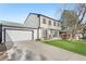 Attractive two-story home with a lush green lawn and a spacious two-car garage at 4733 S Vivian Ct, Morrison, CO 80465