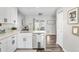 Modern kitchen with white cabinets, stainless steel appliances, and hardwood flooring at 4733 S Vivian Ct, Morrison, CO 80465