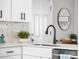 Updated kitchen featuring sleek countertops, stainless steel appliances, and white cabinetry at 4733 S Vivian Ct, Morrison, CO 80465