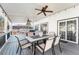 Outdoor patio with ceiling fans, dining area, and comfortable seating at 4733 S Vivian Ct, Morrison, CO 80465