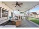 Inviting covered patio with cozy furniture and a fire pit, perfect for gatherings at 4733 S Vivian Ct, Morrison, CO 80465