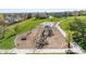 A modern playground features varied climbing structures and play equipment with park views at 4733 S Vivian Ct, Morrison, CO 80465