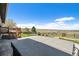 Spacious yard featuring a hot tub, deck, and open views of the serene landscape with fencing for privacy at 7701 Hillgate Way, Parker, CO 80134