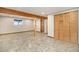 Finished basement has wood beams, tile floor and storage closet at 7701 Hillgate Way, Parker, CO 80134