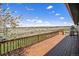 Expansive deck providing panoramic views of the fenced yard, open landscape, and nearby hot tub at 7701 Hillgate Way, Parker, CO 80134