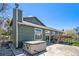 Exterior of home showing hot tub, back deck, neutral color palette, and mature trees at 7701 Hillgate Way, Parker, CO 80134