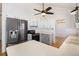 Well-equipped kitchen with painted brick, modern appliances, white cabinets, and ample storage at 7701 Hillgate Way, Parker, CO 80134