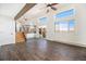 Beautiful living room with wood-look floors, a door to the outside, and lots of windows at 7701 Hillgate Way, Parker, CO 80134
