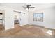 Main bedroom features a sliding barn door to ensuite, carpet and a sunlit window with views at 7701 Hillgate Way, Parker, CO 80134