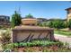 Attractive community entrance with landscaping and a welcoming sign at 10510 Ladera Dr, Lone Tree, CO 80124